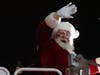 Santa waves to the crowd.