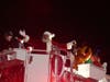 Santa arrives on a firetruck after the tree is lit on Town Hall Green.