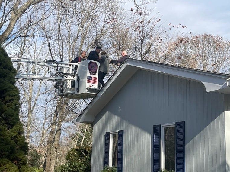 Fairfield firefighters rescue a resident who was trapped on her roof.