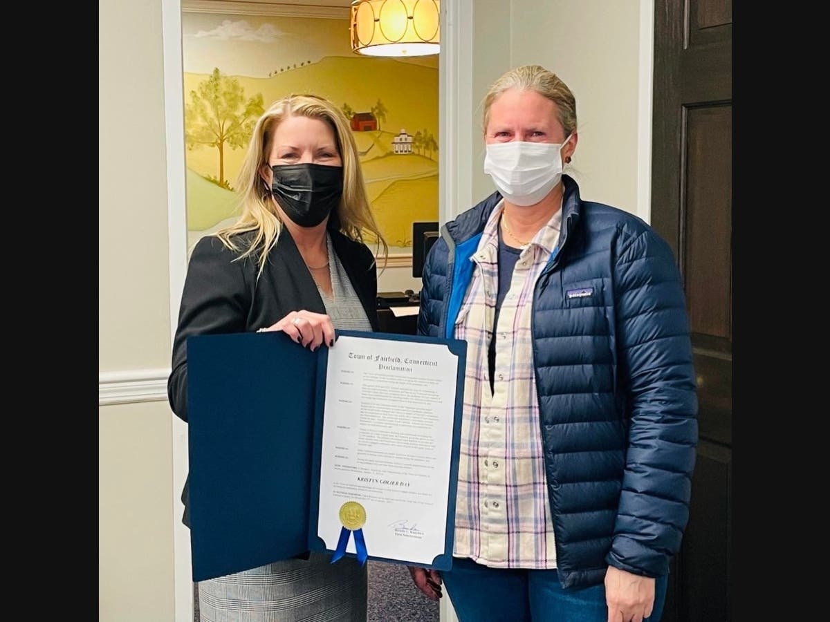 First Selectwoman Brenda Kupchick presents Kristyn Golier with a proclamation Wednesday.