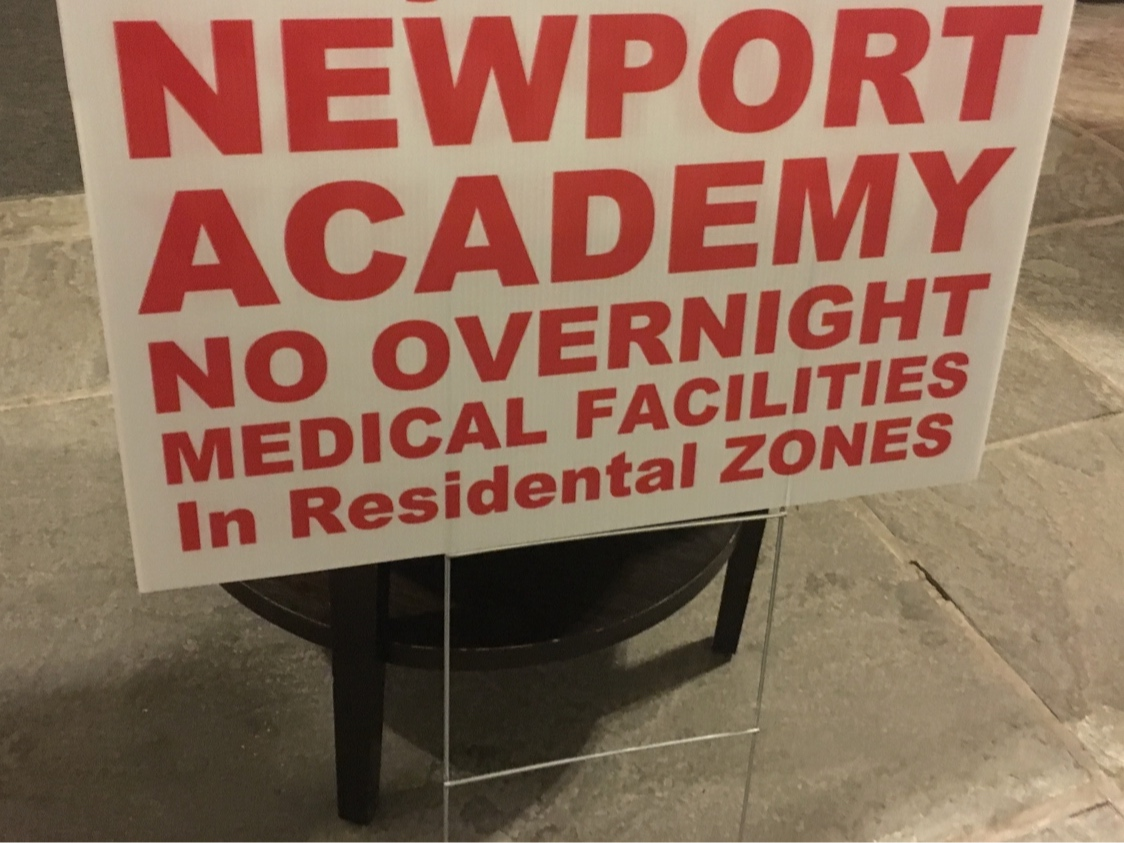 A lawn sign opposing Newport Academy is seen in this 2019 file photo.