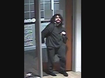 Police are seeking to identify the man above, who picked a lock to enter Fidelity Investment Center on March 4.