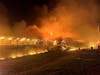 Firefighters battle the blaze at Forsman Farms.
