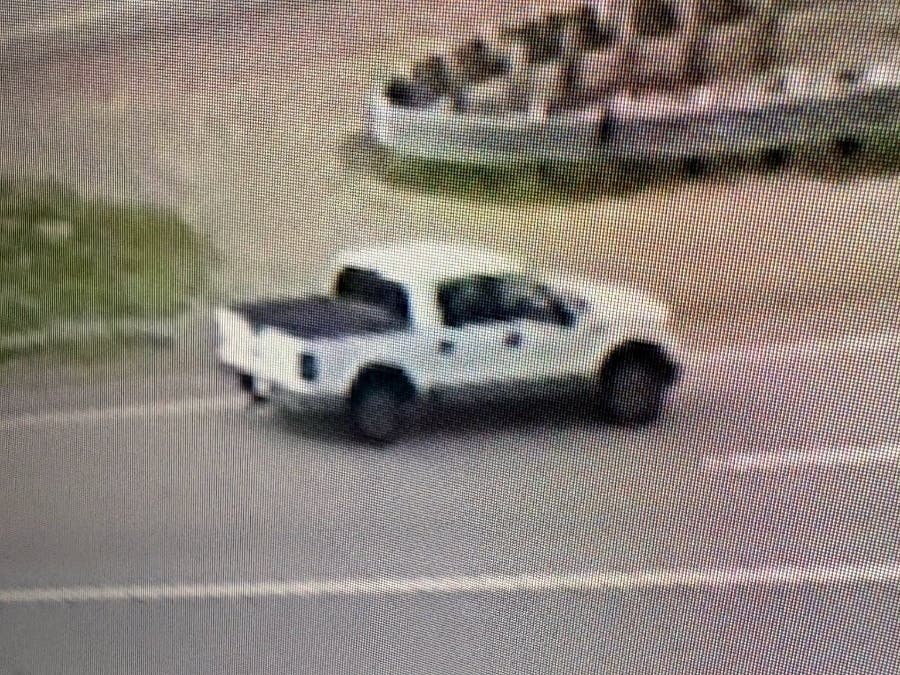 Investigators are seeking information about a 2010–14 white Ford F-150 four-door pickup with black handles, gray rocker panels, a black tonneau cover, and visible rust around the driver's side rear wheel well and fender, police said.