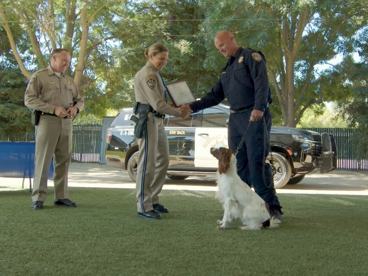 Officer Nick Layton and K-9 Lincoln attend a graduation ceremony on Friday.