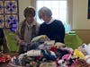 Roundtable board members Fay Farber and Sue Abrams sort items and fill Valentine's Day gift bags