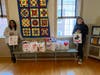 Roundtable members pose with some of the completed Valentine gift bags