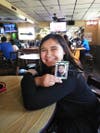 Aurora, now 11, with a photo of her father following Wednesday's verdict of accused killer Timothy Canfield.