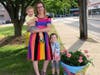 Allie Falconer and her two children, standing by one of her painted flower pots
