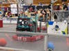 The iRaiders’ robot races across the field during a match. 
