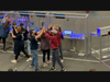 The iRaiders’ drive team celebrates a win with the other blue alliance teams.