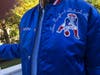 A vintage official New England Patriots NFL jacket with the “Joe Patriot” and WHDH logos donated by retired AP bureau chief and MHTV host of  “Up for Discussion" is among 35 items in the Marblehead Harbor Rotary's "Holiday Pops-of-Fun Online Auction."