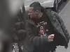 The suspect (shown) is described as a white male, with short, buzzed style hair, wearing a black shirt and shorts.​ 