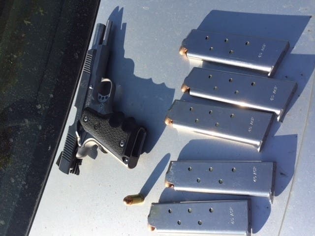 The weapons and magazines discovered at the scene.