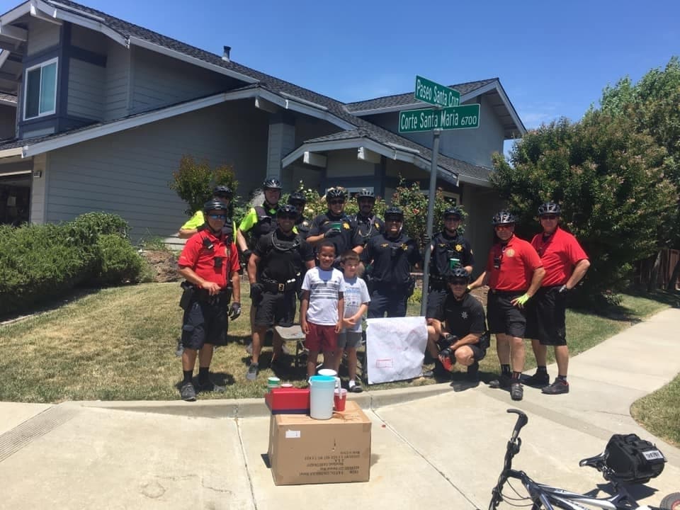 Officers and the young entrepreneurs in Pleasanton.