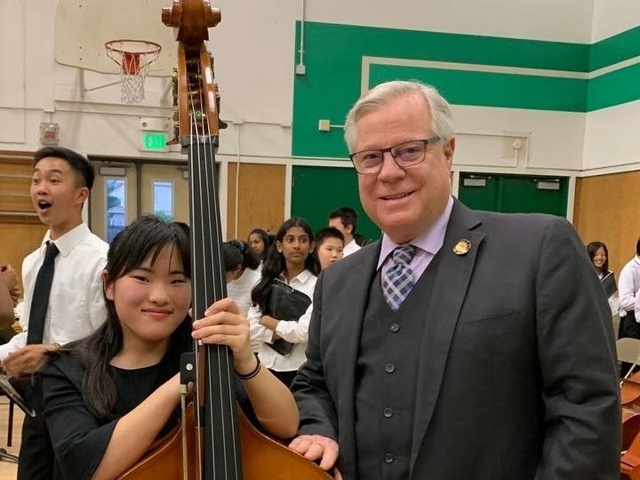Supervisor Scott Haggerty (r) with a student during the Hopkins Junior High School Spring Orchestra Concert last week.