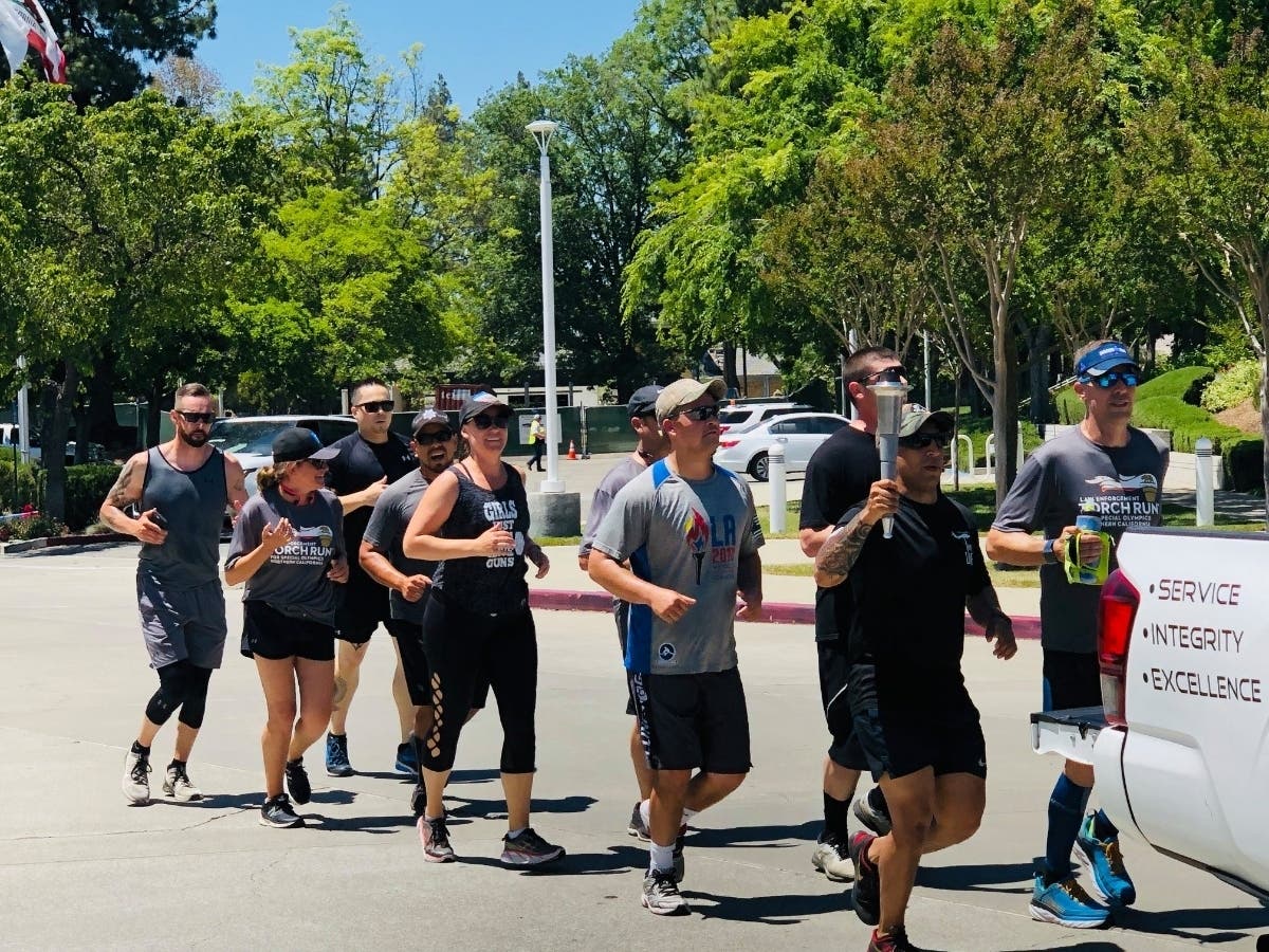 The Tracy PD handoff of the Special Olympics torch to Livermore police, Friday June 14, 2019.