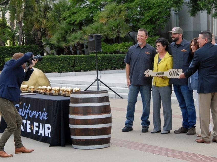 State Assemblymember Susan Talamantes Eggman honors Craig Cauwels and Kyle Manigold from Morgan Territory. 