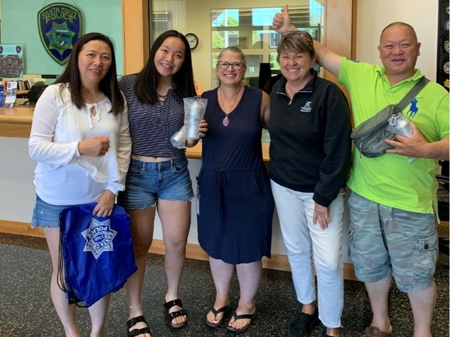 The family and the SCPD "super sleuth" (center).