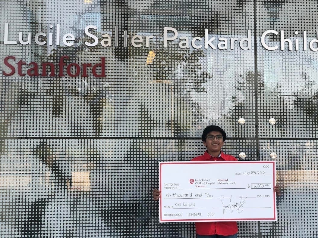 Sumukh Cadpakar​​ during his 2018 check presentation to Lucile Packard Children's Hospital Stanford in Palo Alto​.