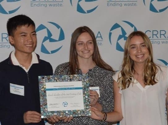 Club officers accepting the "Next Generation Recycler" Award.