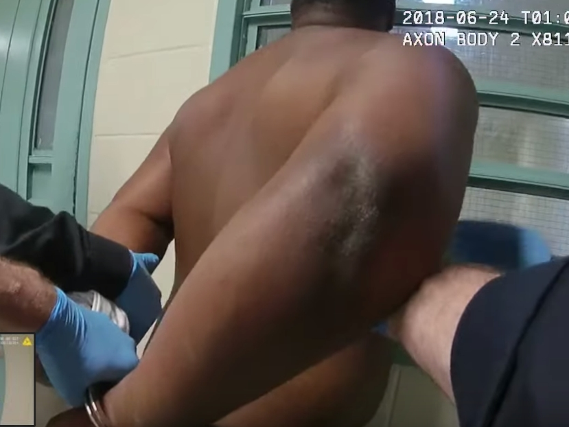 A screenshot taken from police video of the June 2018 incident shows Armstrong being escorted by deputies at the jail just before his death.