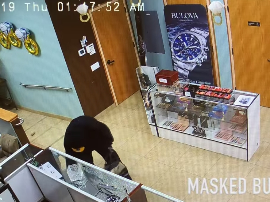 The masked burglar who is still being sought.
