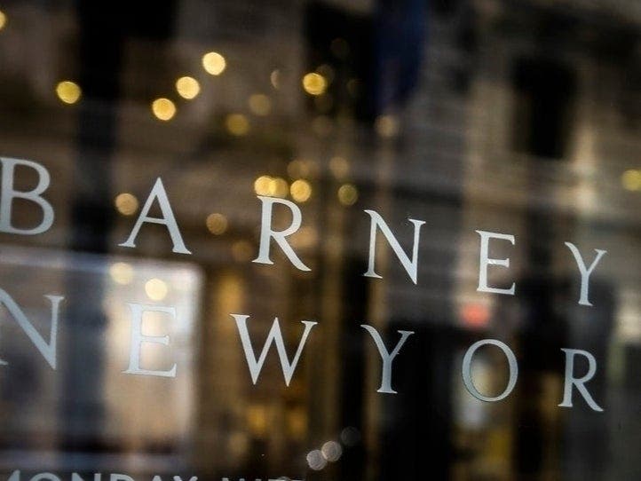 Signage for Barneys New York department store is displayed on the store's window, Tuesday July 16, 2019.