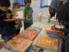 Christian Robinson autographs books during his Nov. 6 visit to Joe Michell School.