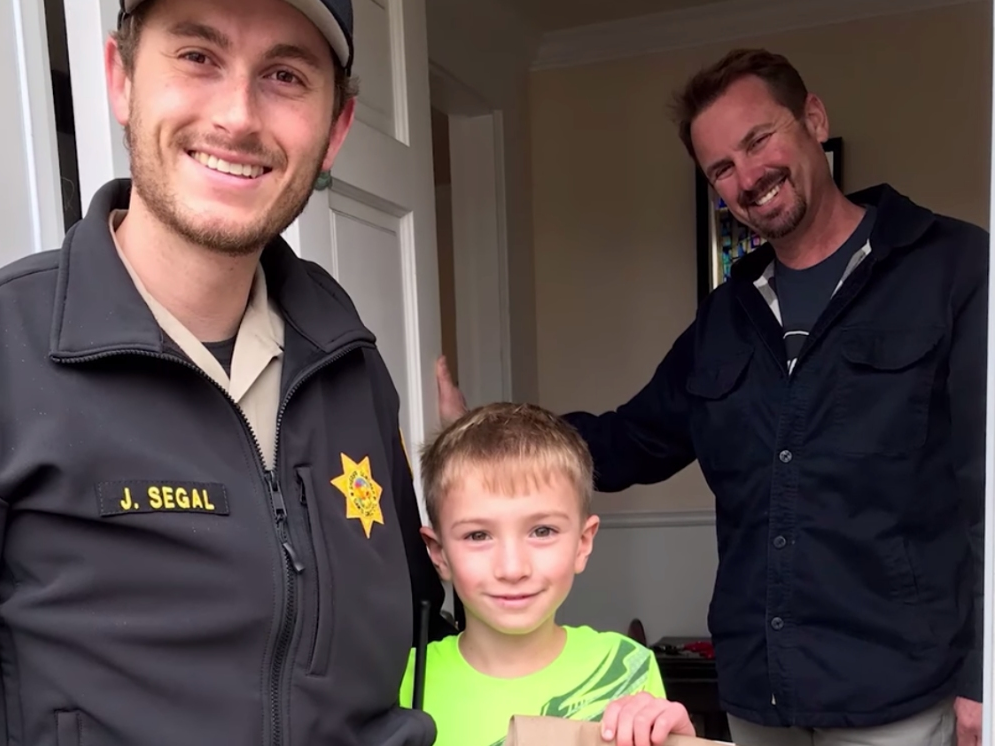 A Santa Cruz County deputy bearing a gift makes a surprise visit to a child who wrote to Santa.