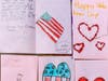 Handcrafted Valentine's Day cards made by AHES students.