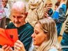 Jessica Molstad, PTA president, Antelope Hills Elementary School, reads a Valentine's Day card to a veteran at VA Loma Linda Healthcare System.