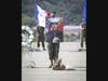 A U.S. Marine with Battalion Landing Team 1/4, 15th Marine Expeditionary Unit, holds the portrait of Pfc. Bryan J. Baltierra, 18, of Corona, California, during a memorial service at Marine Corps Base Camp Pendleton, California, Aug. 21, 2020. 