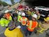 Crews at the spill site.