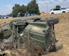 The overturned vehicle.