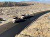 The road remains open to traffic during construction, with a reduced speed limit.