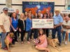 Catharine Reed, H.N. and Frances C. Berger Foundation Vice President of Charitable Programs, presents a $25,000 Coachella Valley Spotlight grant to representatives of Living Free Animal Sanctuary at the Living Free Desert Outpost.