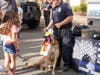 A Murrieta Police Department K-9 team shows off for a youngster.