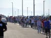 Shoppers line up Friday morning to be among the first to enter the new Costco store.
