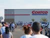 Shoppers line up Friday morning to be among the first to enter the new Costco store.