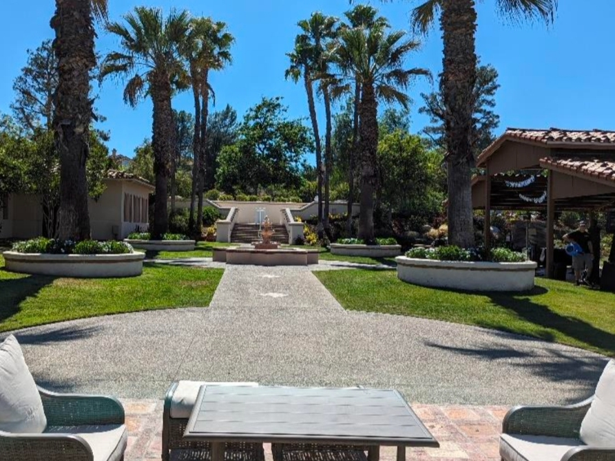 Looking west along the southern boundary of the project site at Redhawk Golf Course, toward existing pedestrian amenities and structures.