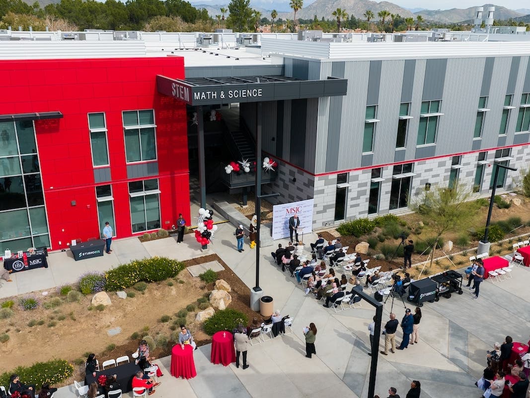 An aerial view shows community members gathered for the ribbon-cutting and dedication of the Math and Science Building at Mt. San Jacinto College’s Menifee Valley Campus, celebrating the completion of Measure AA.