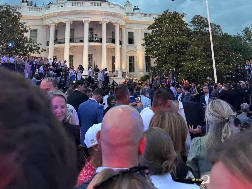 People gather on the White House lawn to watch the the June 14, 2026, UFC Freedom 250 event.