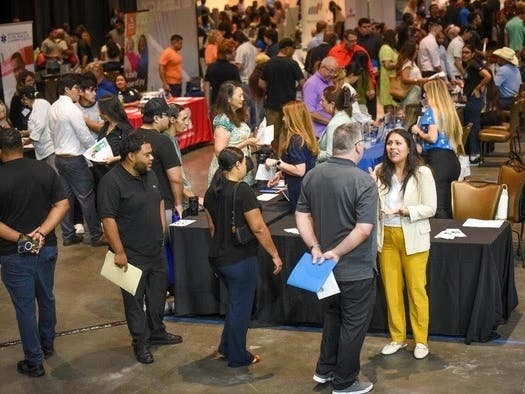 Job seekers visit employer booths during last year’s Valley-Wide Employment Expo held at the Fantasy Springs Resort Casino Special Events Center in Indio.