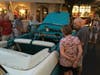 One couple examines Steven Mebs's 1956 Chevy Bel Air convertible.
